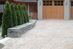 Landscaping: Shrubs, wall and driveway pavers